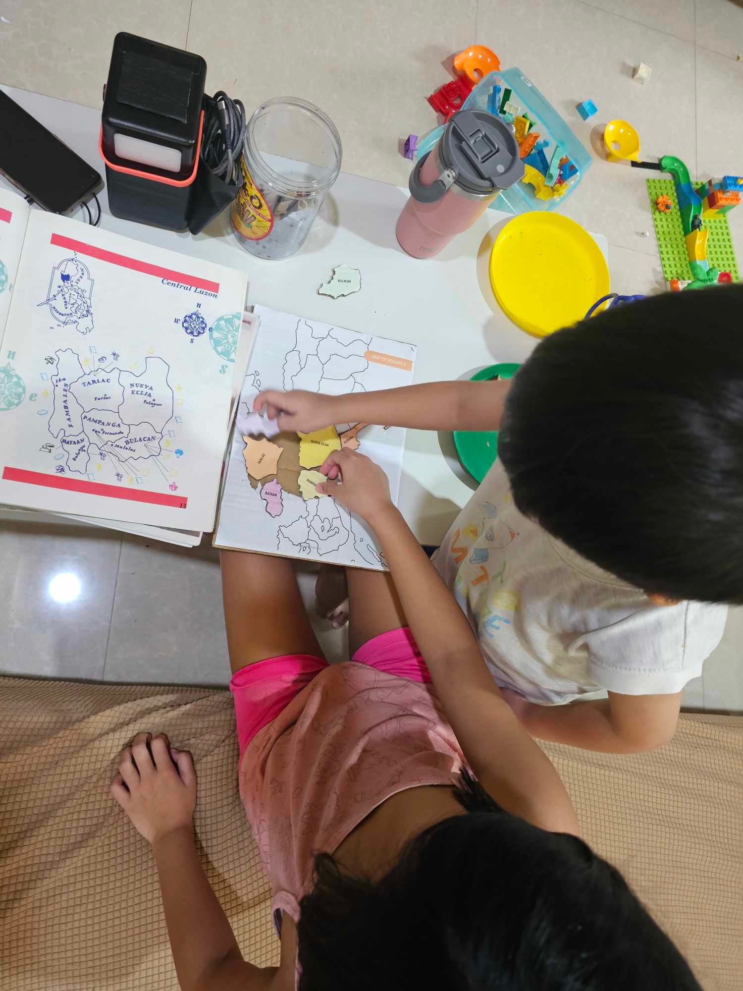 T and K working on the puzzle together